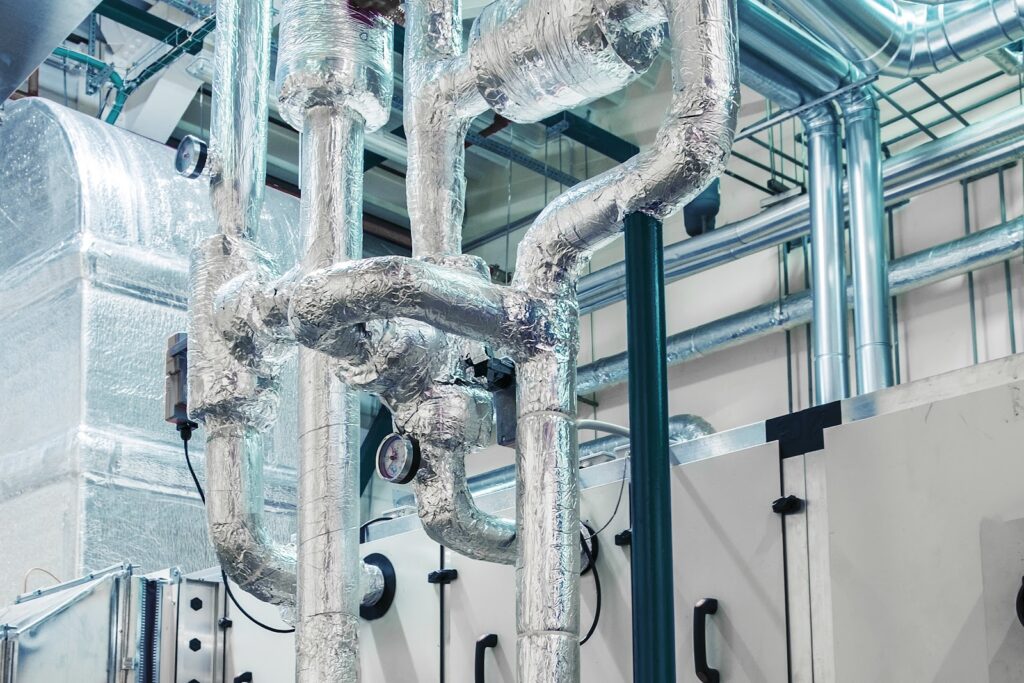 Insulated piping in a closed loop water system showing valves, gauges, and components used to maintain water quality, prevent corrosion, and improve efficiency.