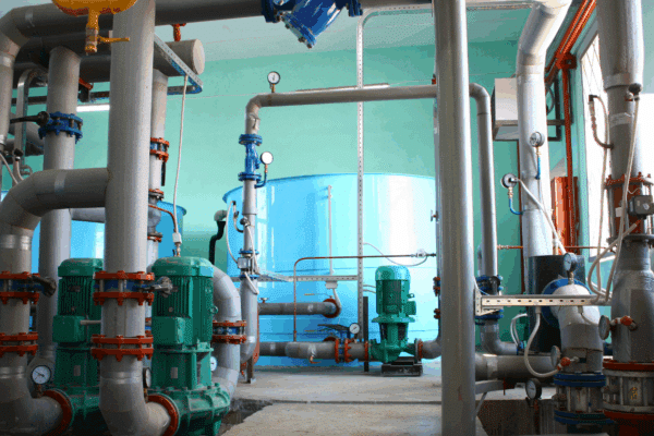 Industrial water treatment system showing pumps and piping used for water treatment