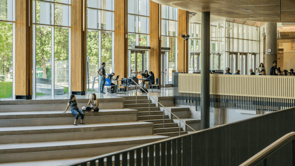 University campus interior with students, highlighting the need for unified university water treatment systems.